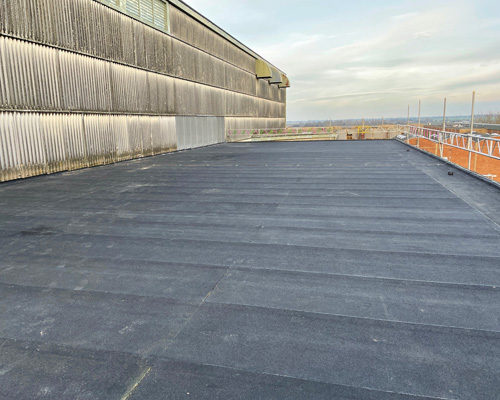 Building 21 showing installation of new flat roof